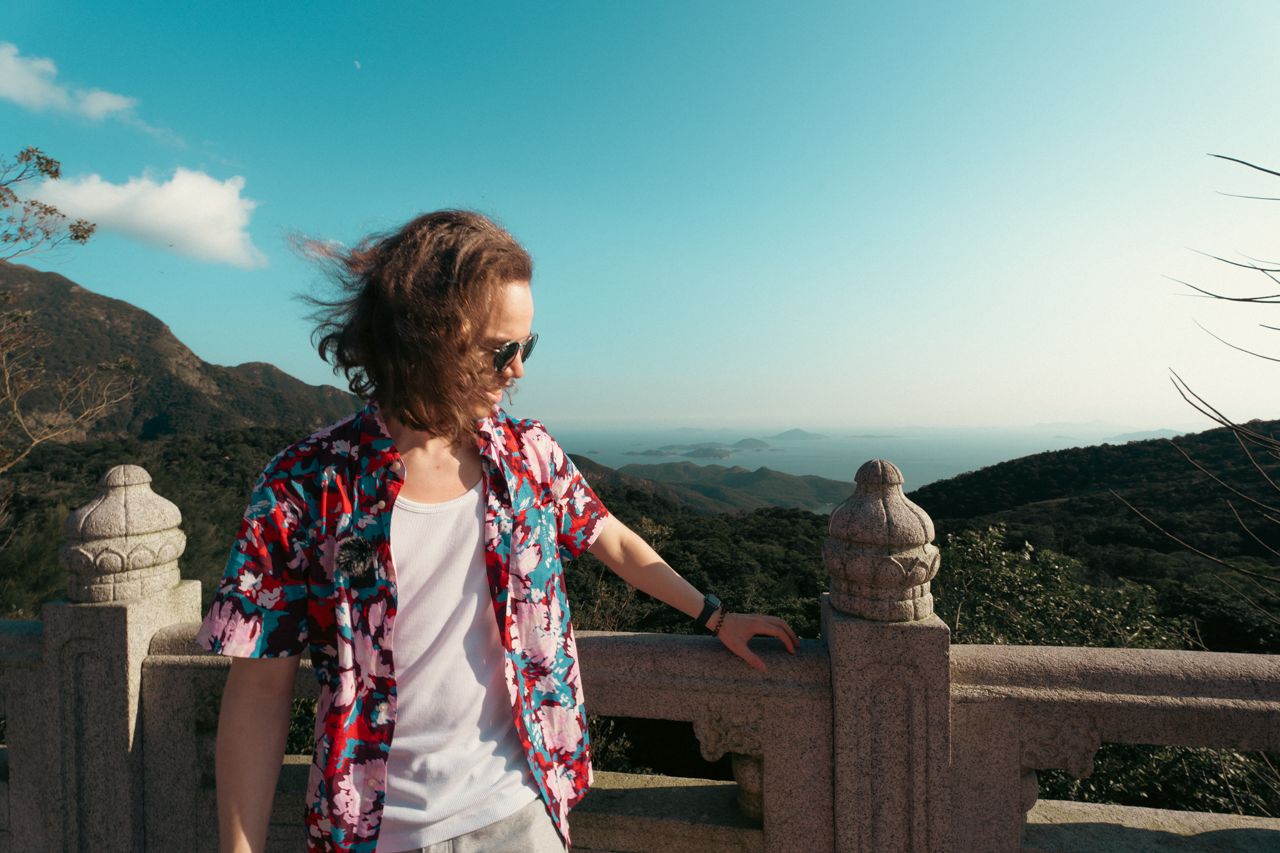 Man smiling at terrace, Big Buddha, Tian Tan Buddha