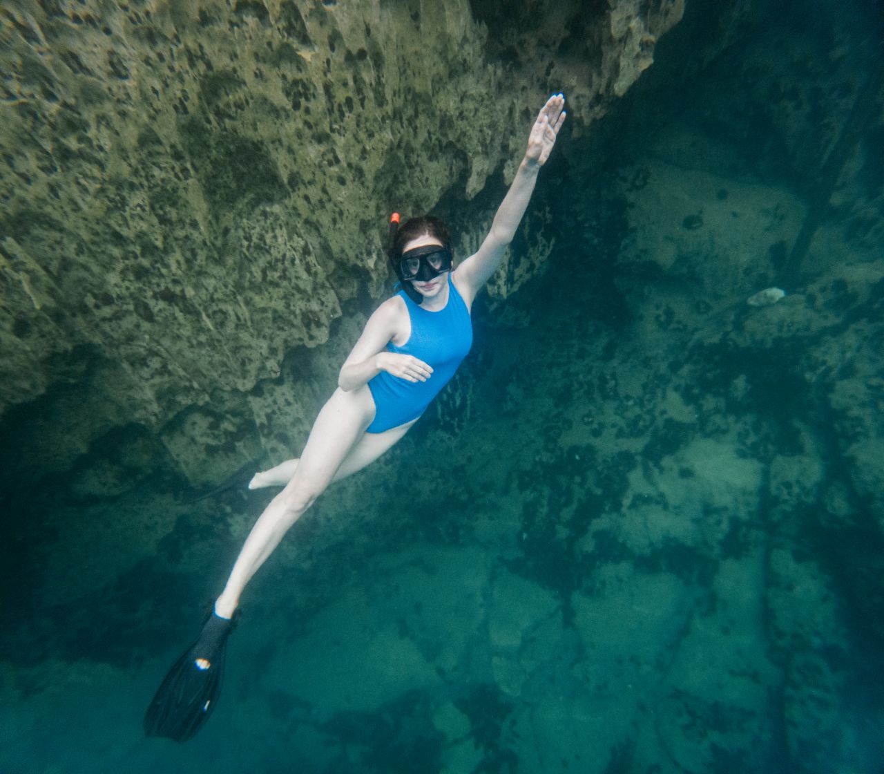 Women doing free diving at Barracuda Lake, Coron, Philippines