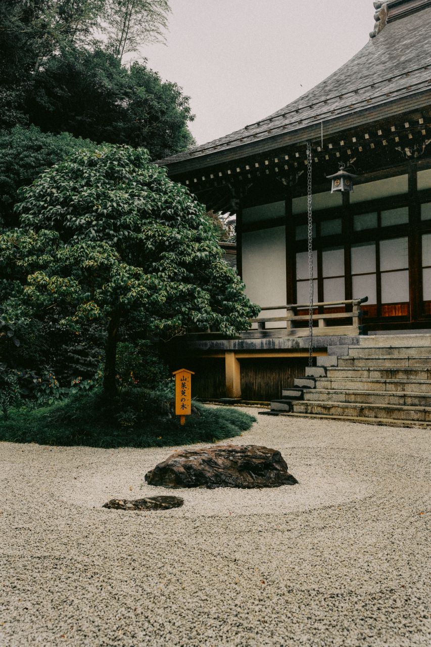 Zen garden at Hokoku-ji Temple in Kamakura, Japan, showing lines in the sand.