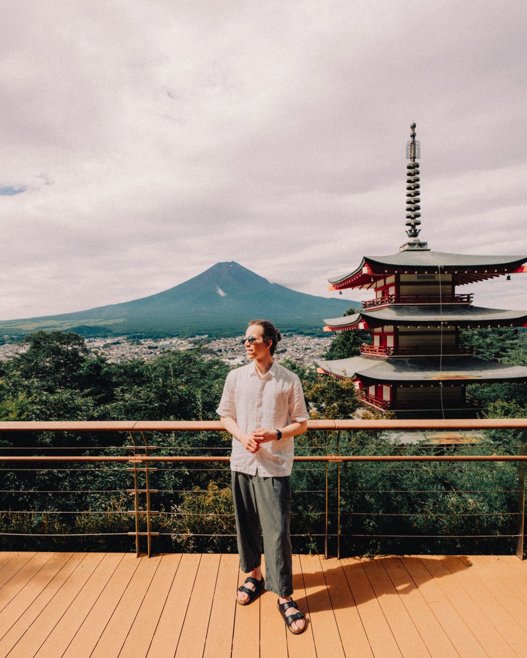 A man watching Chureito Pagoda and Mount Fuji in Japan.