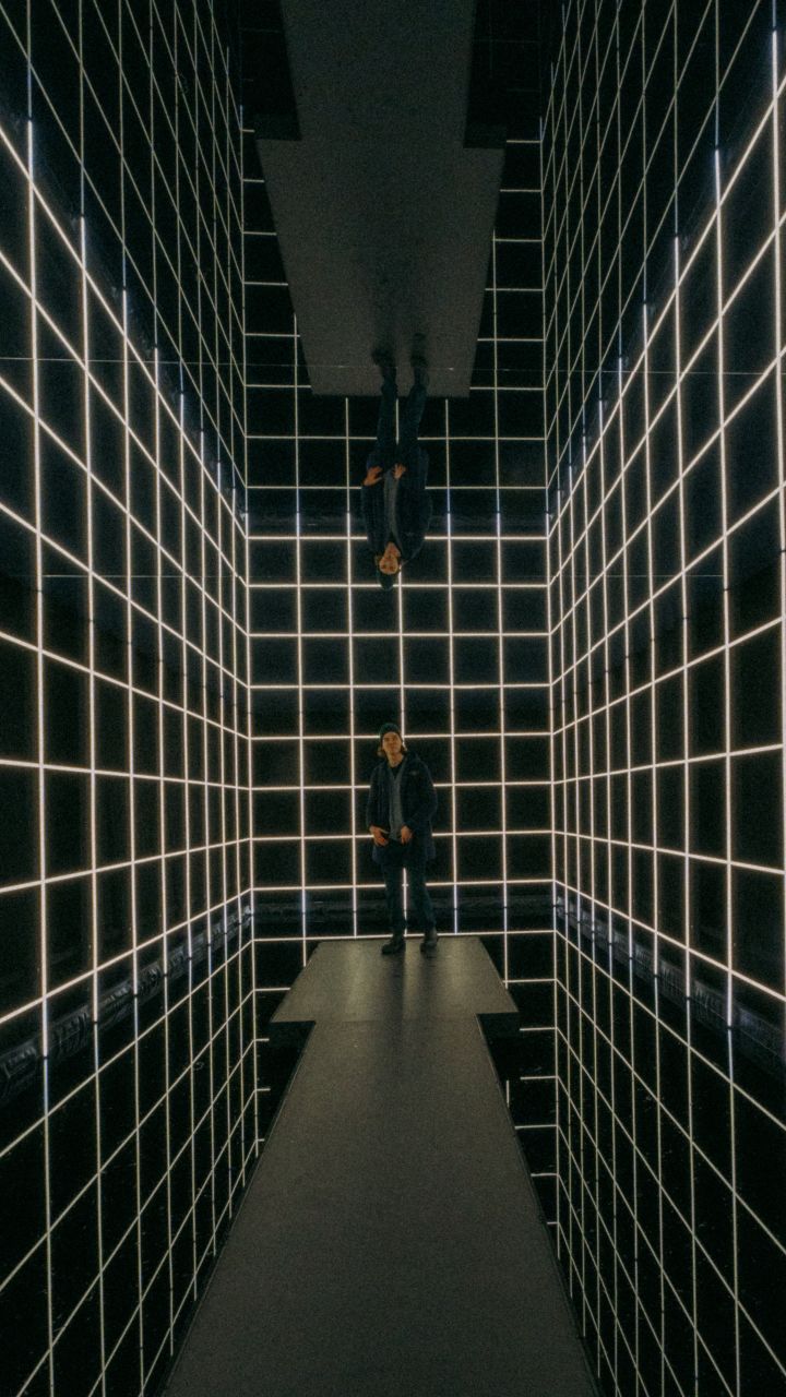 A man at Amsterdam Light Festival installation.