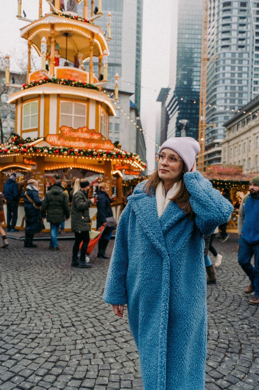 A woman at Rossmarkt Christmas Market in Frankfurt.