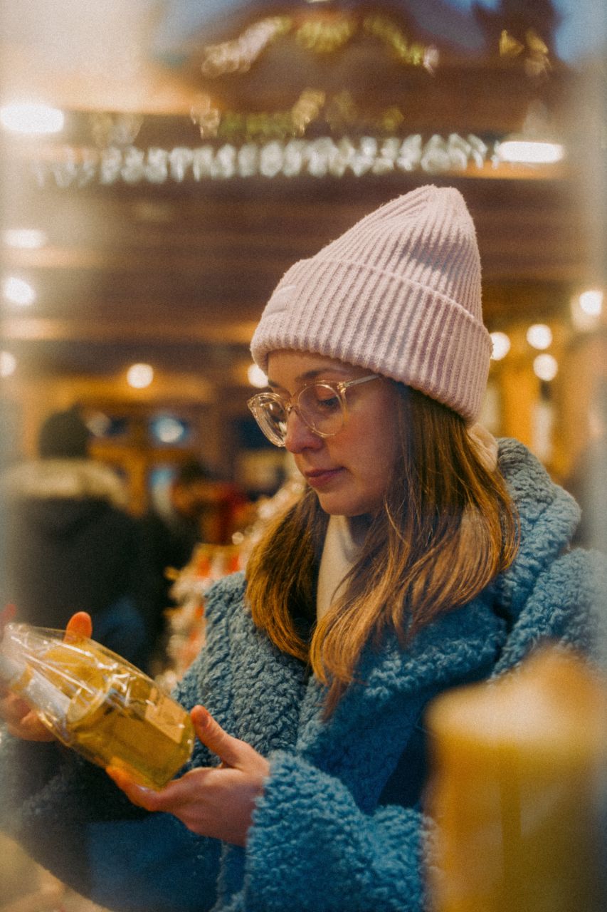 A woman shopping at a Christmas market in Frankfurt.