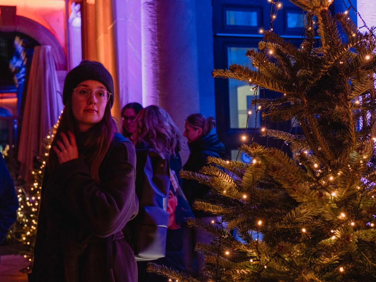 A woman at Christmas Market at Thurn und Taxis Palais.
